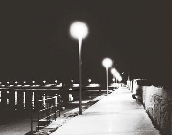 Illuminated street lights at night