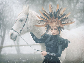 Young woman with ice cream in snow
