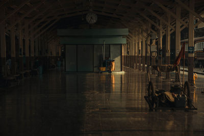 People walking in illuminated building