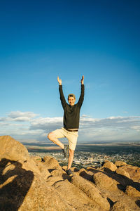 Full length of man standing on rock