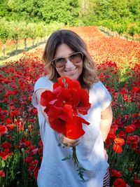 Portrait of young woman with flowers