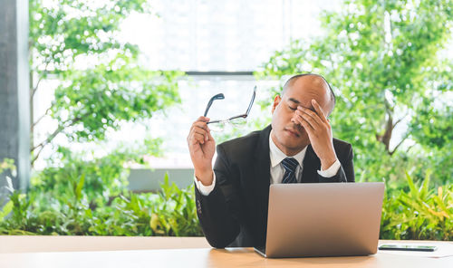 Man using laptop on table