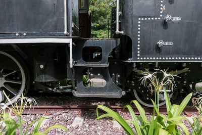 Close-up of abandoned train on field