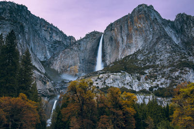 Scenic view of waterfall against sky