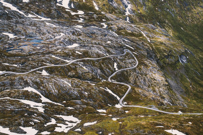 High angle view of water flowing through rocks