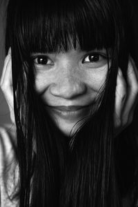 Portrait of smiling young woman with bangs