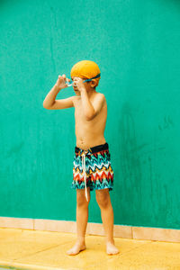 Portrait of little boy in swimming pool