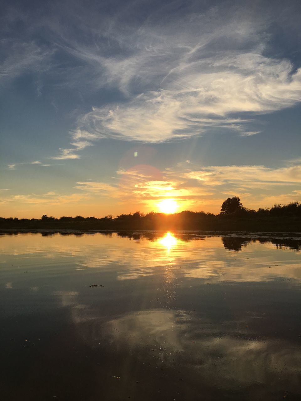 reflection, sunset, water, tranquil scene, scenics, tranquility, sun, beauty in nature, sky, lake, calm, waterfront, nature, orange color, cloud, cloud - sky, standing water, remote, no people, solitude, majestic, non-urban scene, vacations