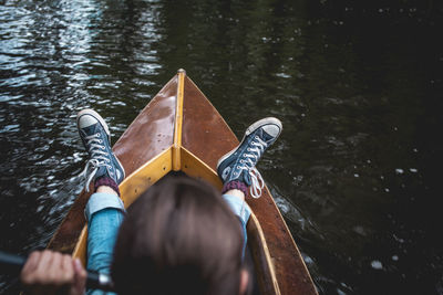 Low section of men on boat in canal