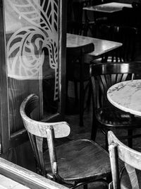 Close-up of empty chairs and table in restaurant