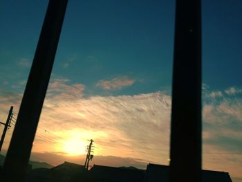 Low angle view of silhouette trees against sky at sunset