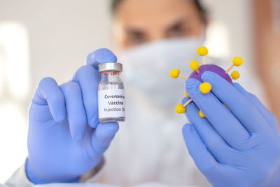 Close-up of human hand holding eyeglasses
