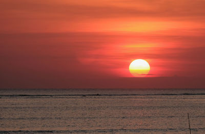 Scenic view of sea against romantic sky at sunset