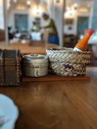 Close-up of wicker basket on table at home