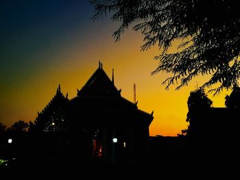 Low angle view of silhouette trees against sky during sunset