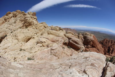 Rock formations on mountain against sky