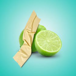High angle view of lemon slices on blue background