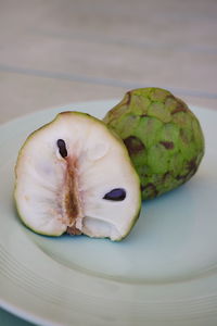 High angle view of fruit in plate on table