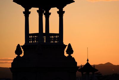 Silhouette of monument during sunset