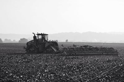 Tractor tilling field