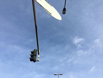 Low angle view of street light against sky