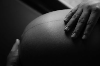 Close-up of pregnant woman hand 