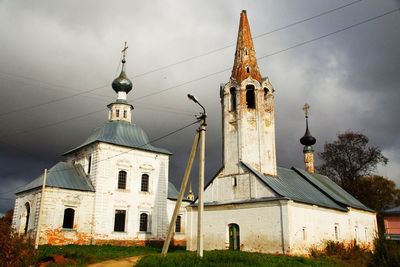 Old churches against cloudy sky