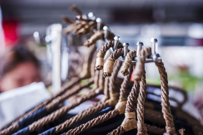 Close-up of hangers line at store