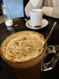 Close-up of cappuccino on table