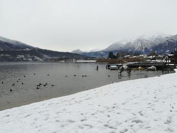 Scenic view of snow covered mountains against sky