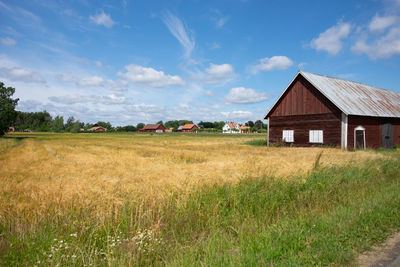 House on field against sky