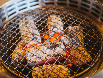 Close-up of meat on barbecue grill