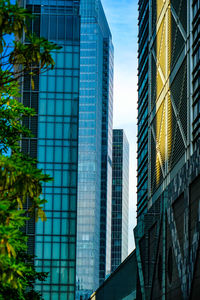 Low angle view of skyscrapers against sky