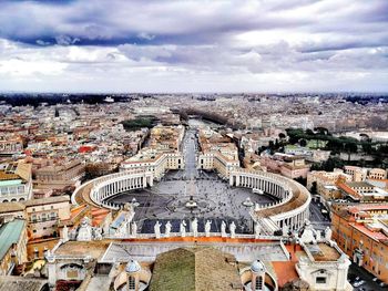 High angle view of st peter square and city against cloudy sky