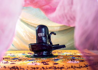 Close-up of old machine on table