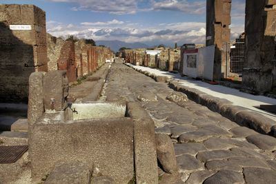 View of old ruin building against cloudy sky