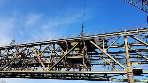 Low angle view of rollercoaster against sky