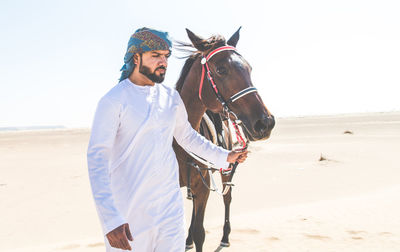 Man wearing mask on sand