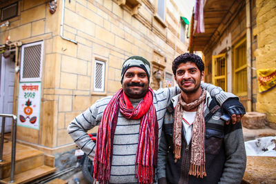 Portrait of smiling young man in city