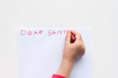 Directly above shot of text on paper against white background