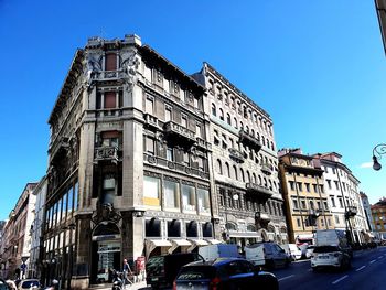 Low angle view of building against blue sky