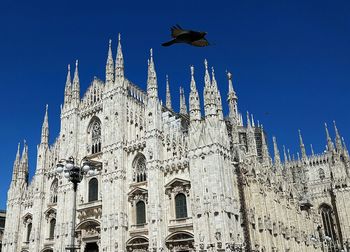 Low angle view of cathedral against blue sky