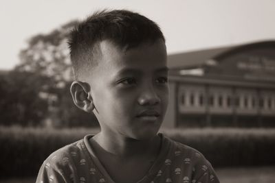 Close-up portrait of boy looking away