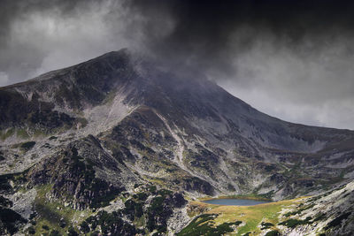 Aerial view of volcanic mountain against sky