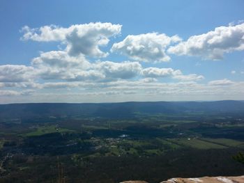 Scenic view of mountains against cloudy sky