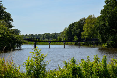 Bridge over river against clear sky