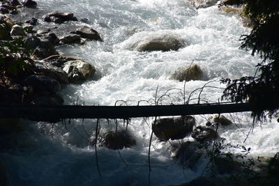 Scenic view of river flowing during winter