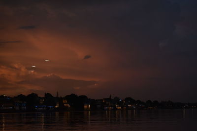 Scenic view of river against sky during sunset