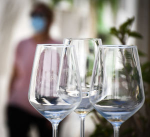 Close-up of wine glasses on table