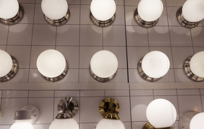 High angle view of illuminated lights hanging on ceiling